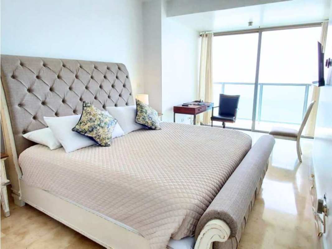 Bright kitchen and dining space with island at PH Yoo Panama on Avenida Balboa