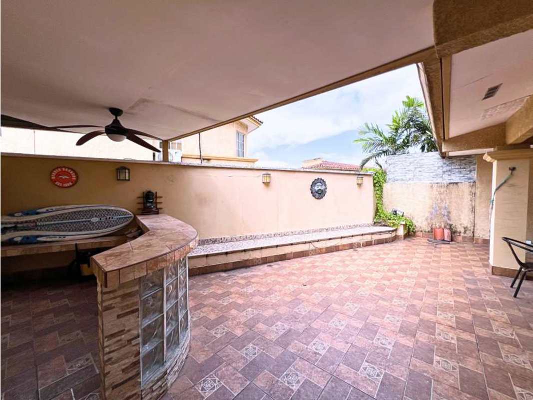 Outdoor patio bar area with seating, wall decor, ceiling fan PH Dorado Spring Panama