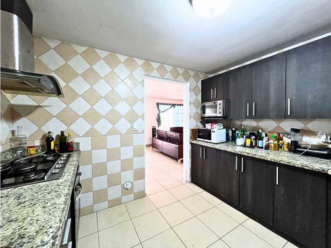 Covered backyard patio with tiled floors and outdoor bar area in PH Dorado Spring Panama