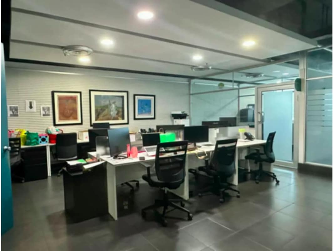 Modern open plan office cubicles glass partitions Torre de las Américas Panama
