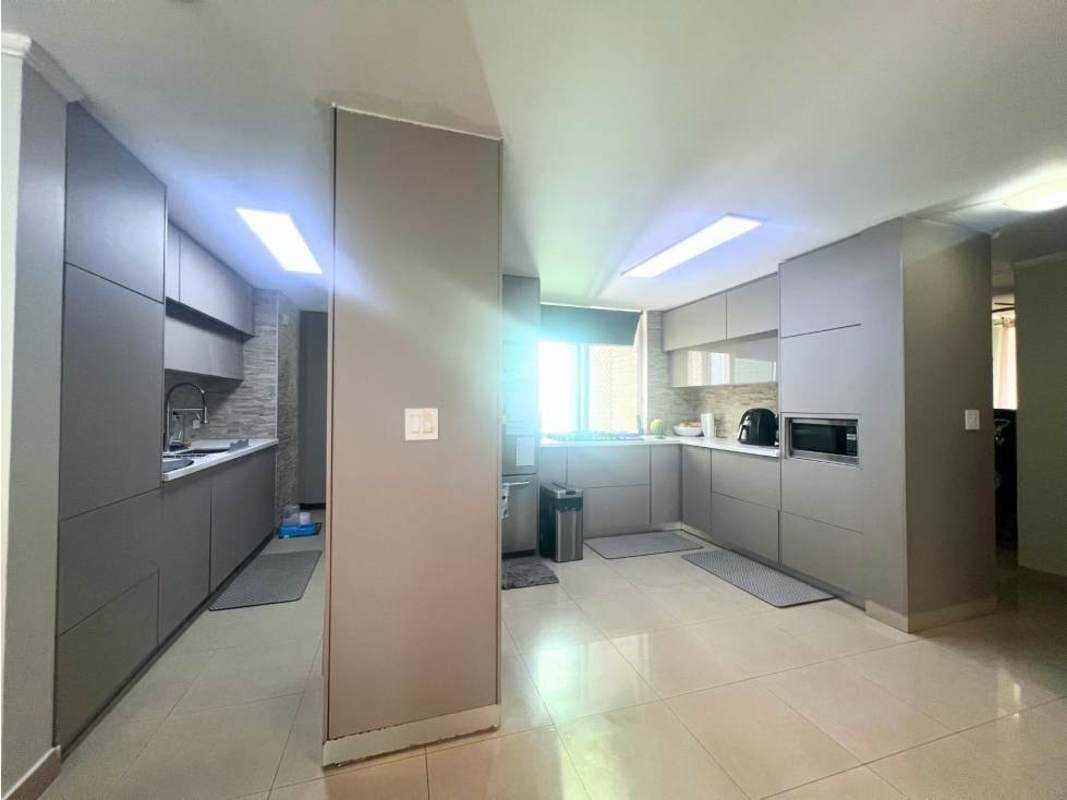 Bright gray cabinetry kitchen with window modern condo PH Pijao Panama City