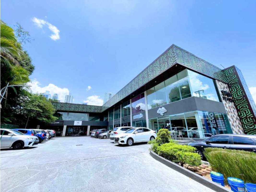 Modern commercial lobby with pendant lights, double-height ceiling, reception counter at Plaza 89 San Francisco
