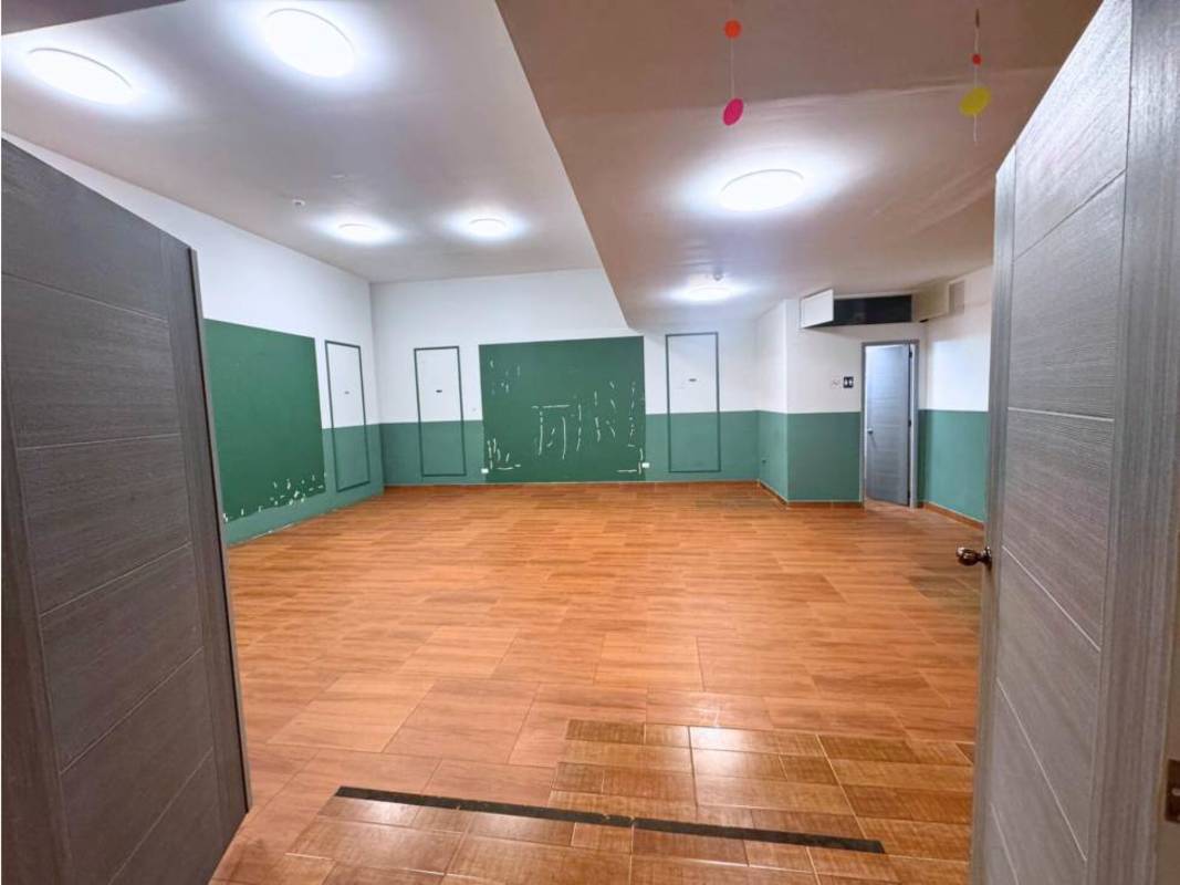 Industrial commercial kitchen space with grease extractor system and tiled walls in Plaza 89 San Francisco Panama