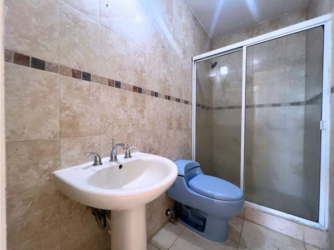 Bathroom with glass shower enclosure, wall mounted faucet and natural lighting at PH Portofino San Francisco Panama