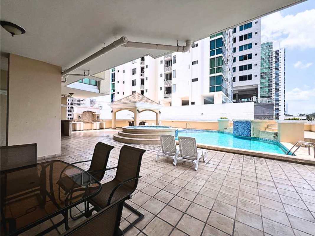 Empty spacious living room with tile flooring and balcony access PH Portofino Panama City