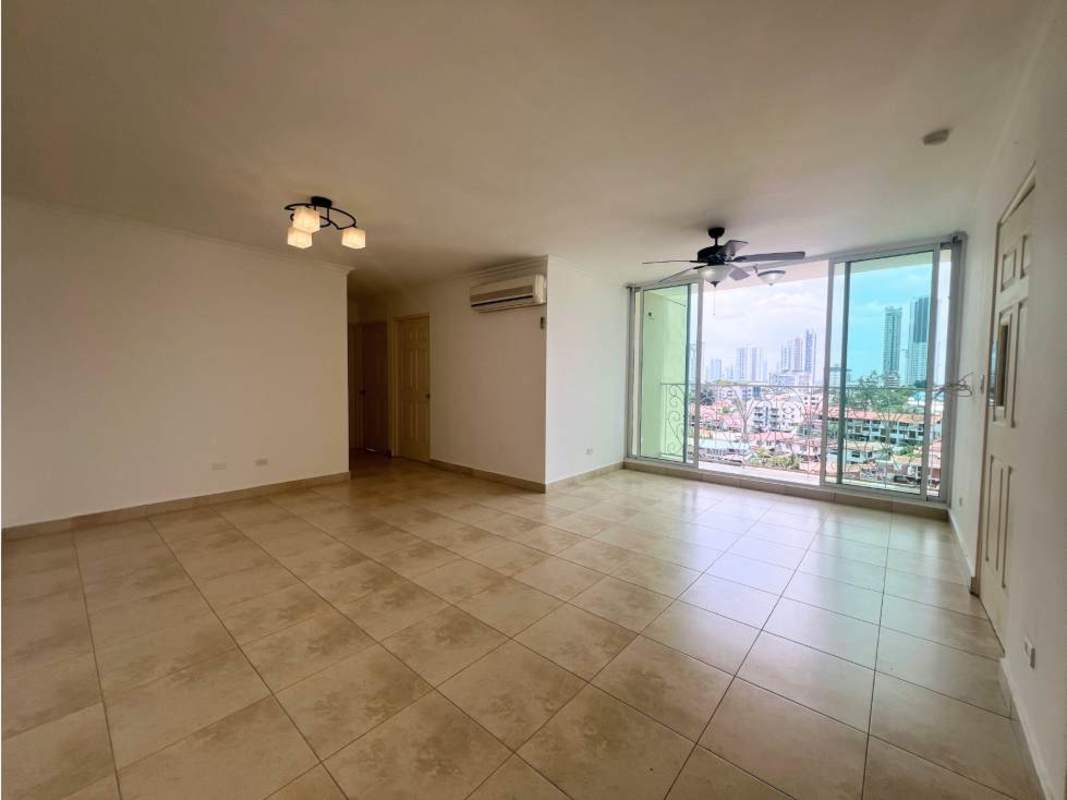 Spacious living room with floor-to-ceiling windows and city skyline view in PH Portofino Panama City