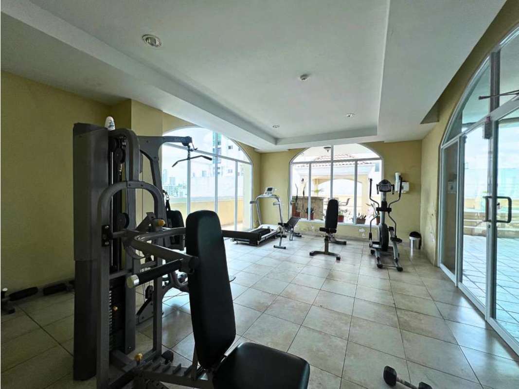 Gym with fitness equipment, large windows, tiled floor in PH Portofino San Francisco Panama