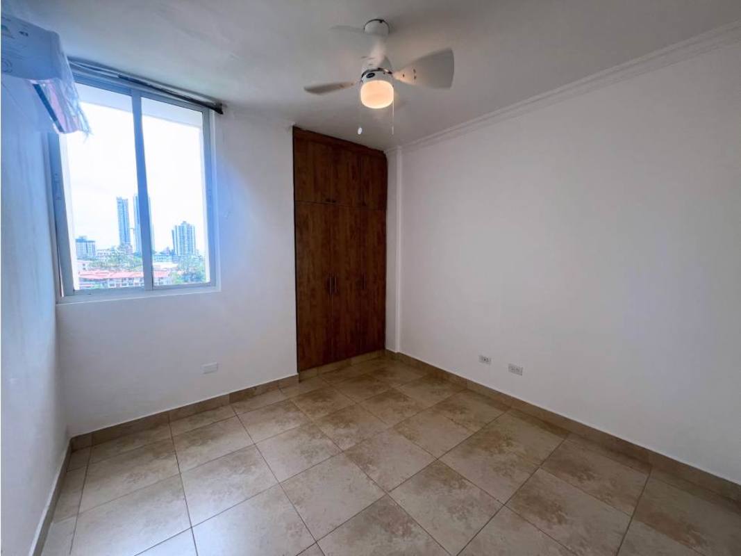 Bedroom with wardrobe, ceiling fan, split AC and city view window at PH Portofino Panama City