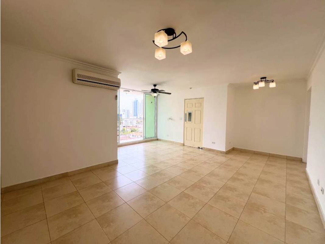 Bathroom with blue toilet, pedestal sink, glass shower enclosure PH Portofino Panama City