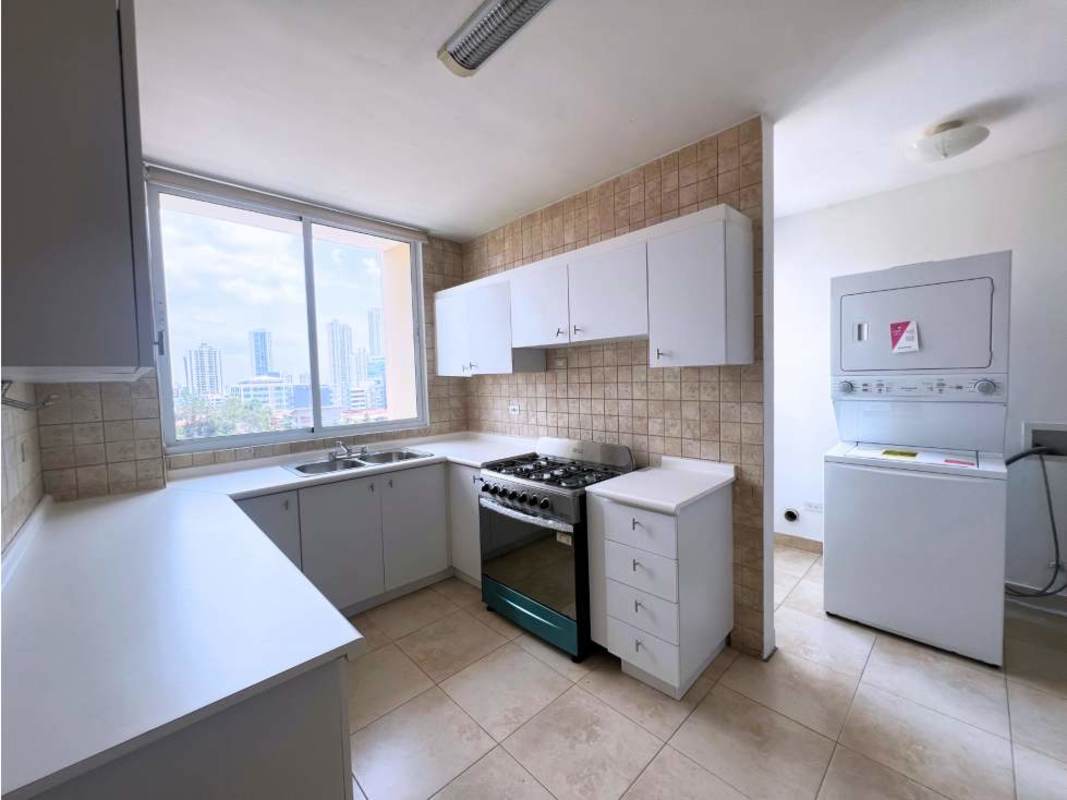 Kitchen with L-shaped counter, window, cabinets, laundry area with washer/dryer PH Portofino San Francisco
