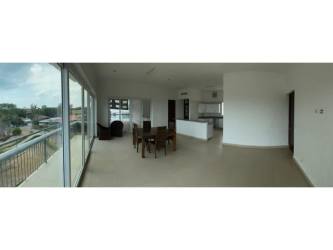 Spacious open living dining area with oceanview balcony PH Punta Barco Village Panama