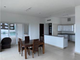 Open dining and kitchen area with modern finishes large windows ocean view Punta Barco Panama