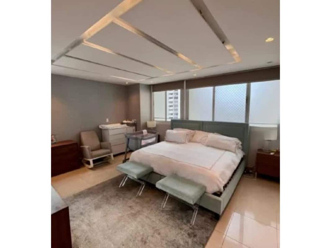 Spacious master bedroom with upholstered bed city views in PH Vista del Sol Punta Paitilla Panama