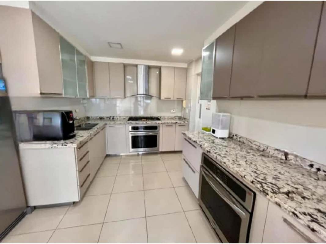 Modern kitchen with granite countertops stainless steel appliances PH Vista del Sol Punta Paitilla Panama