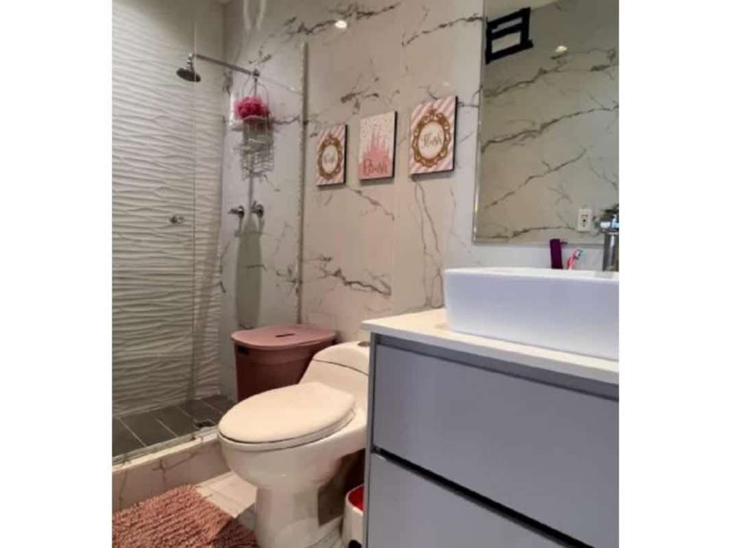 Modern luxury bathroom marble walls vessel sink glass shower in PH Vista del Sol Panama