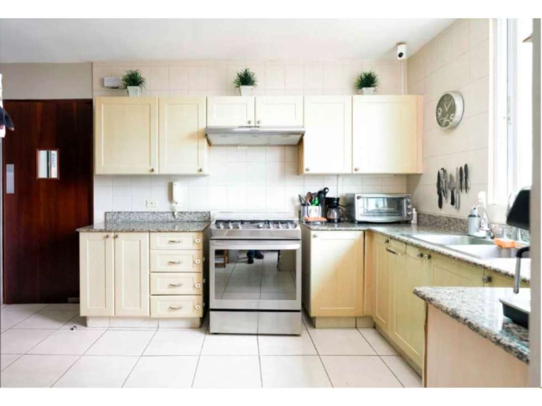 Granite countertop modern kitchen with gas stove stainless steel appliances PH Bahía Obarrio Panama