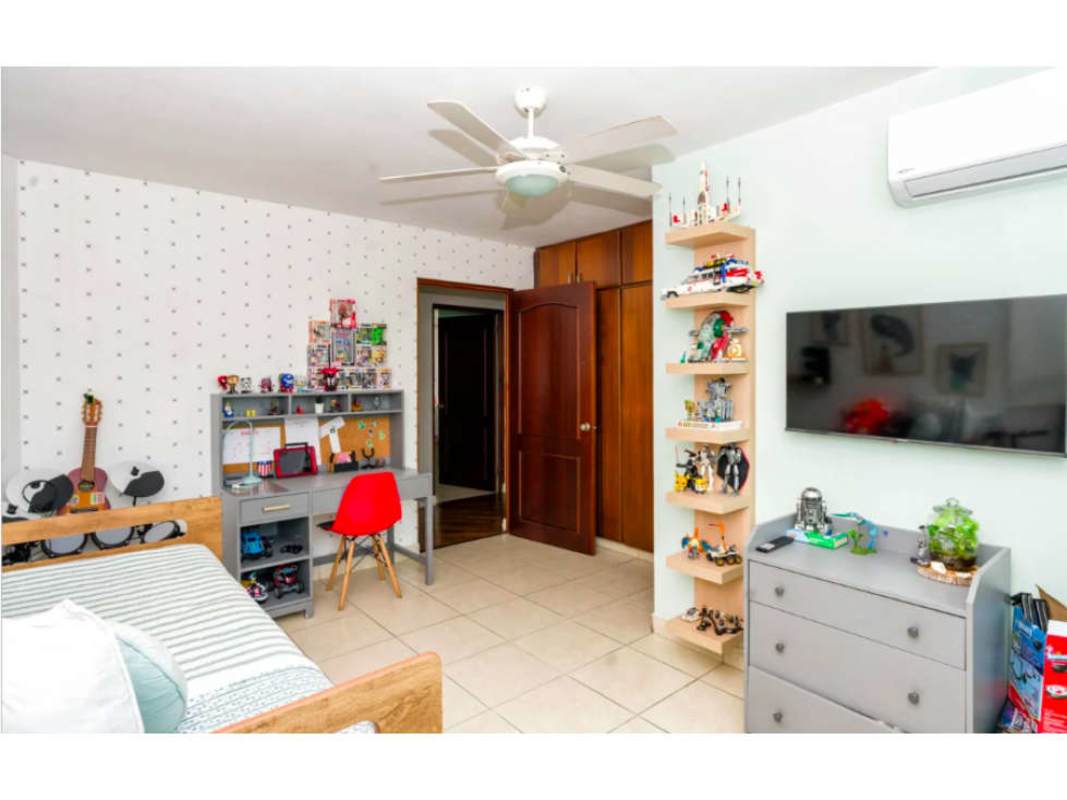 Children's room with pattern wall, toys, drum set playful decor PH Bahía Obarrio Panama