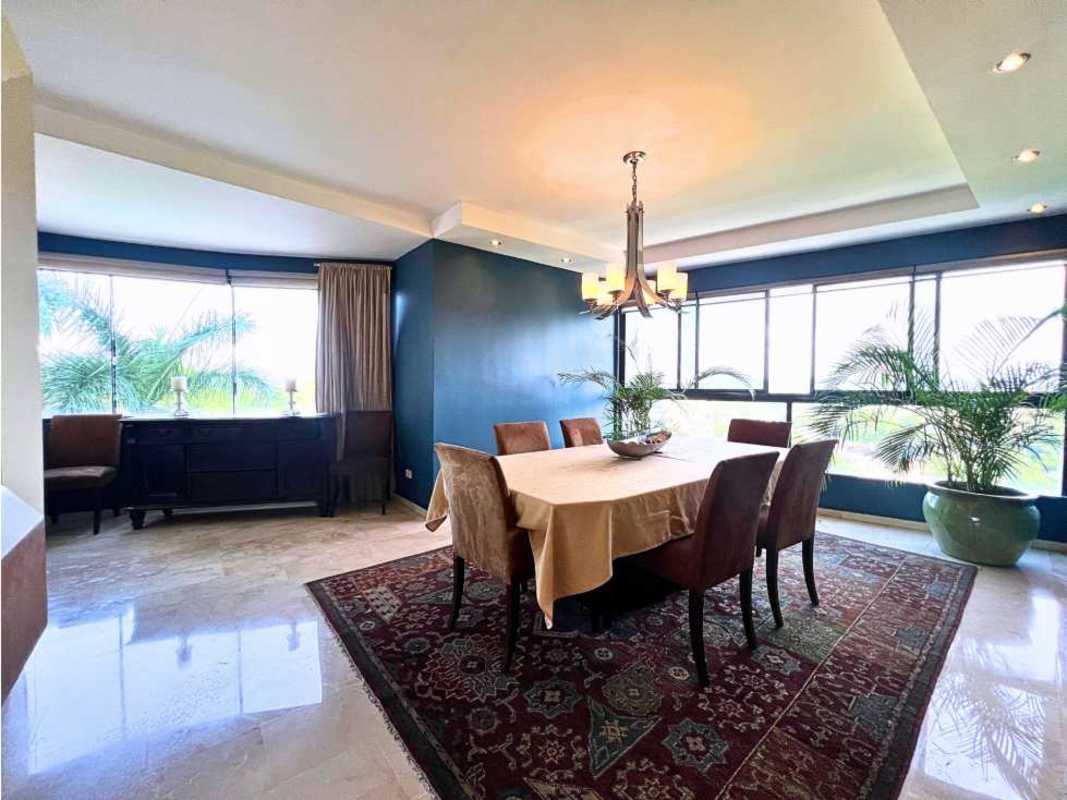 Modern luxury kitchen with granite island, white cabinetry, stainless appliances at PH Elite La Cresta Panama