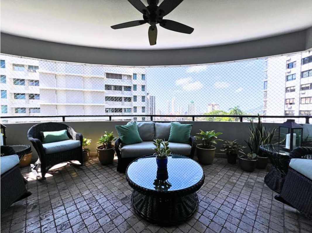 Spacious enclosed balcony lounge area with skyline views at PH Elite La Cresta Panama