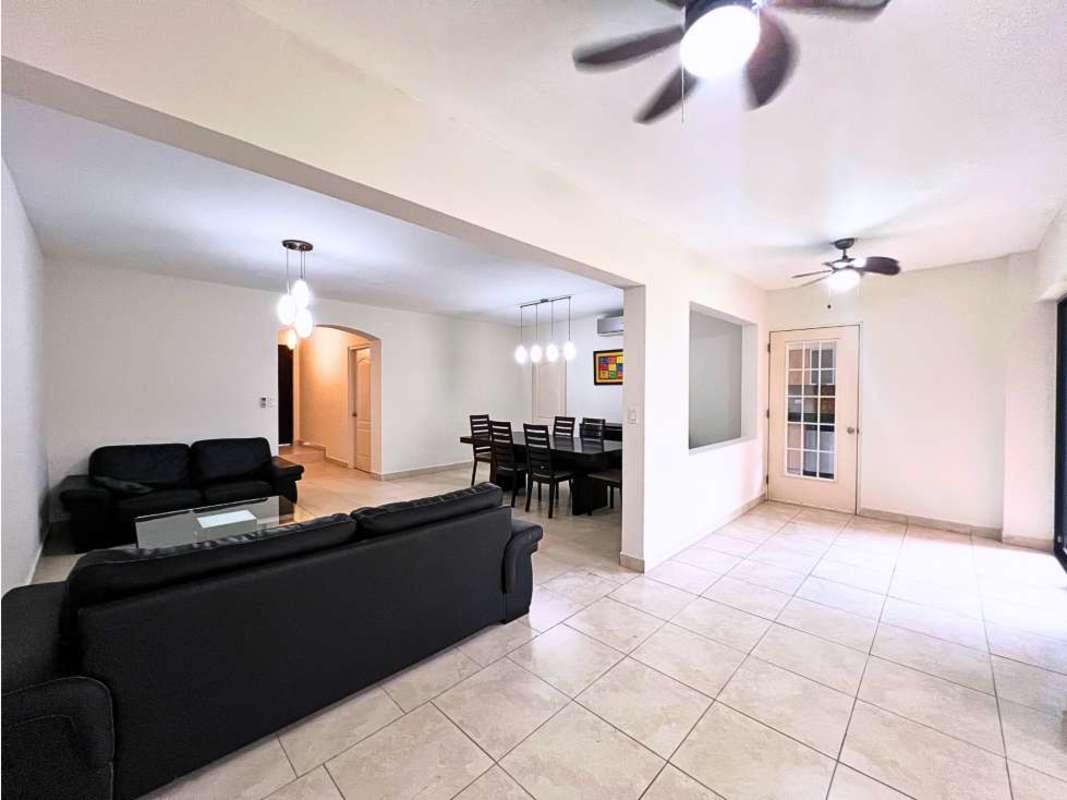 Spacious open plan living-dining with tile floors in Versalles Costa Sur home