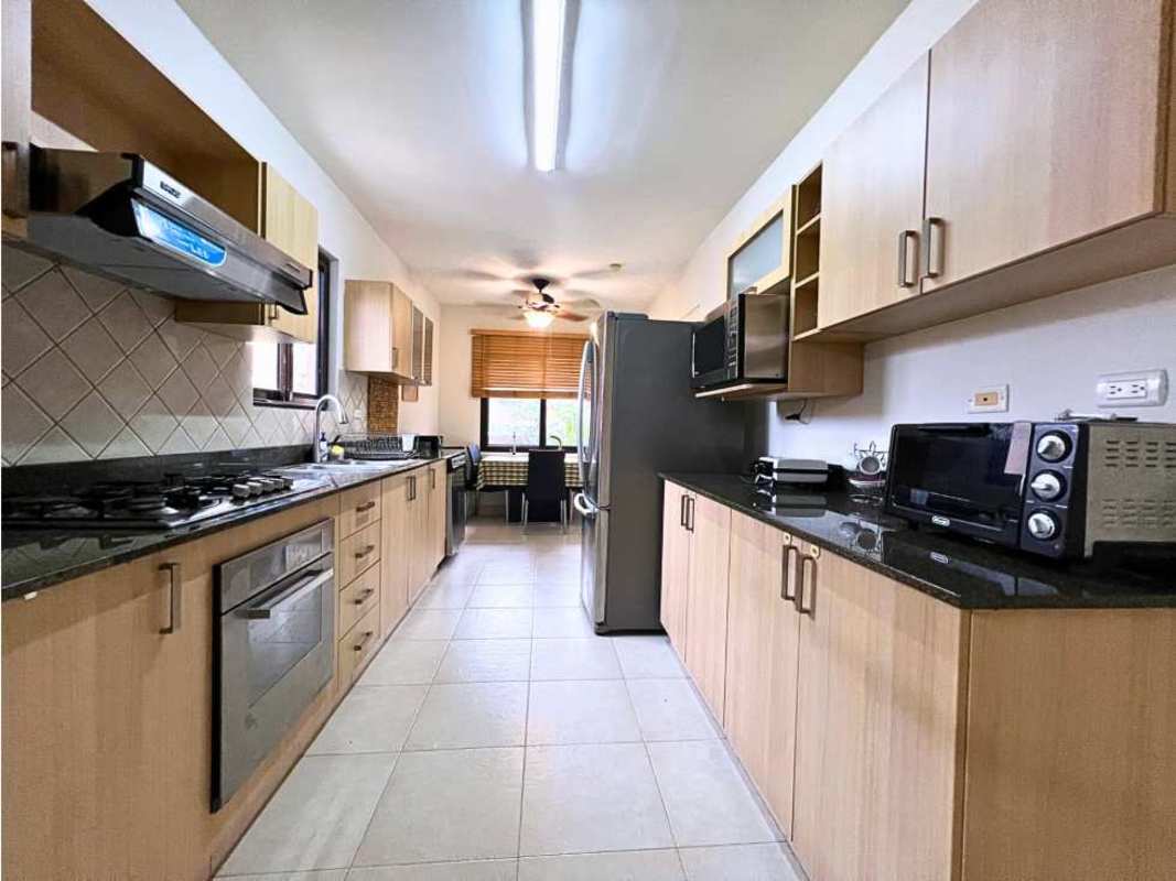 Modern bathroom with granite countertop and glass shower doors Versalles Costa Sur Panama