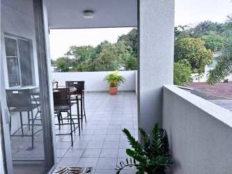 Contemporary kitchen with granite counters and appliances in PH Mosaic Panama Pacifico