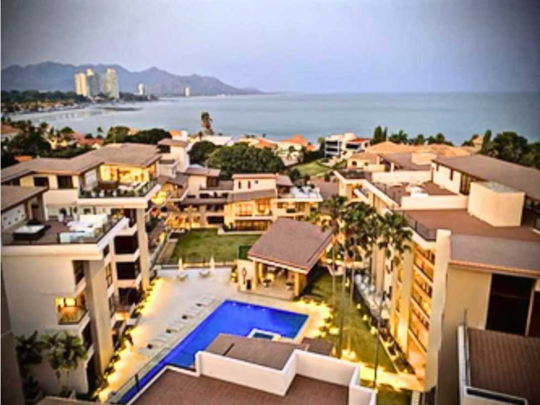 Entrance to Mareas Beach Club with modern metallic signage and logo at Coronado beach Panama