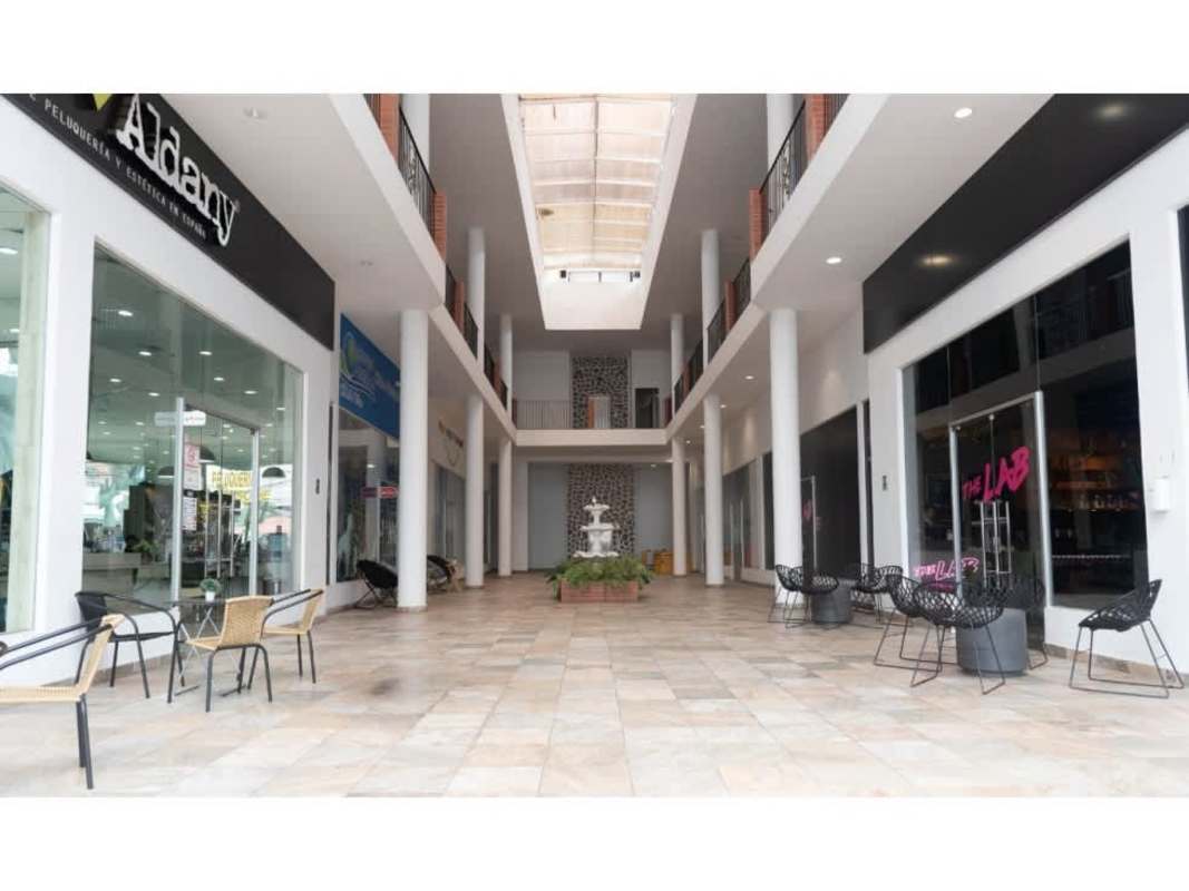Modern shopping corridor with natural light and fountain seating at Plaza Bella Vista Panama