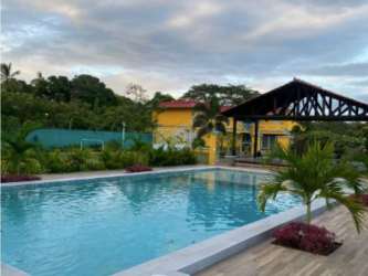 Swimming pool surrounded by lush plants palms tropical design at aparthotel Airbnb Río Hato Panama