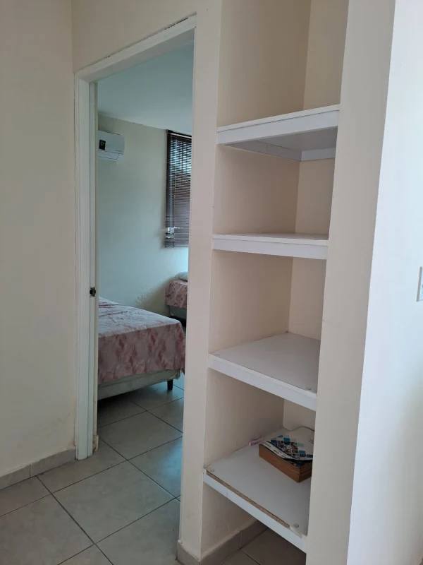 Bedroom with twin beds built-in closet split AC window PH Lefevre Garden Panama