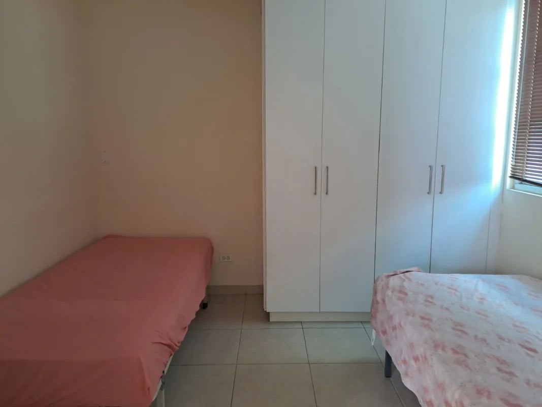 Small kitchen with white cabinetry gas stove refrigerator PH Lefevre Garden Panama