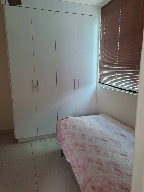 Bedroom with large white wardrobe twin beds tiled floors PH Lefevre Garden Panama