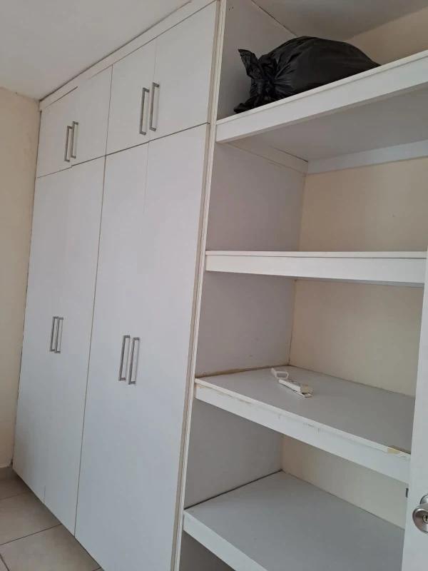 White built-in storage closet shelves Parque Lefevre Panama apartment