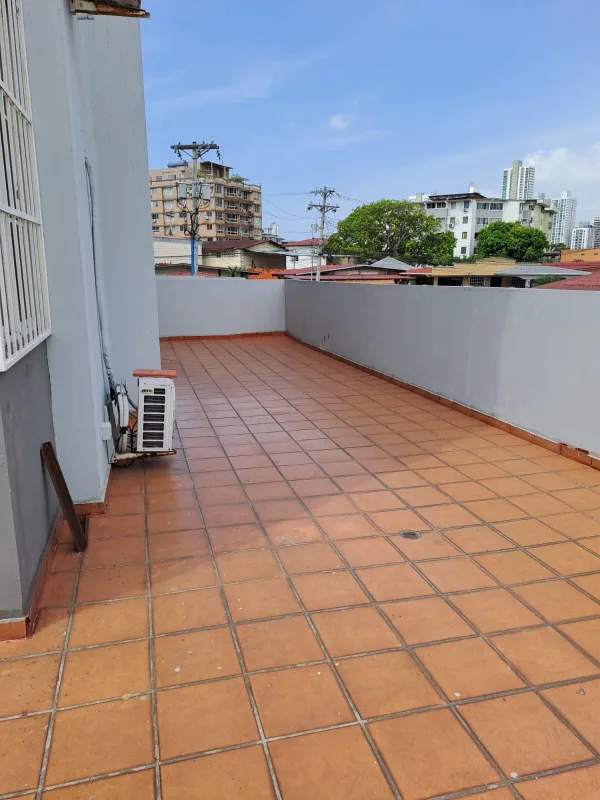 Large terrace with terracotta tiles overlooking neighborhood PH Lefevre Garden Panama