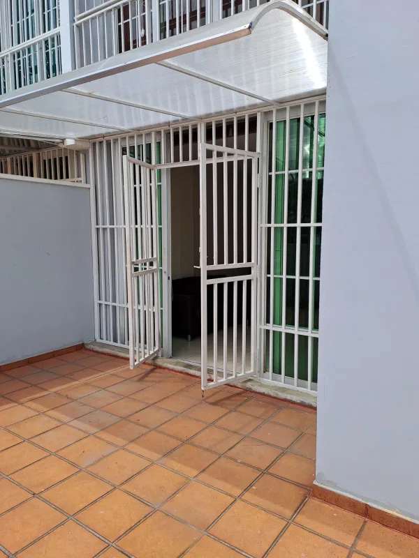 Covered patio entrance with security gates and tiled floors PH Lefevre Garden Panama City