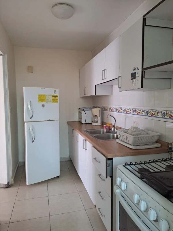 Kitchen with washer utility sink barred window PH Lefevre Garden Panama City