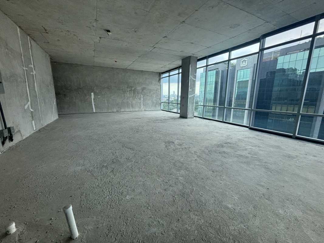 Large raw commercial office area with panoramic city views and floor-to-ceiling windows in Santa María Office Plex Panama