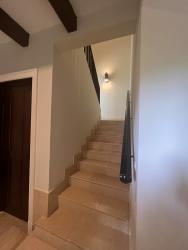 Spacious living room with vaulted ceiling and exposed wood beams in Buenaventura lake villa Panama