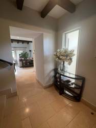 Large covered terrace with seating area and lake views in Buenaventura Panama