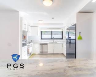 Chef’s designer kitchen with marble countertops and modern appliances in luxury villa San Carlos Panama