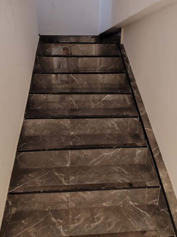 Indoor staircase with marble steps inside commercial space at Plaza 68 San Francisco Panama