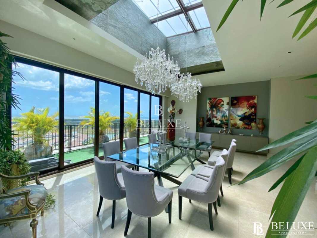 Bright open concept living area with city skyline views marble flooring luxury penthouse Santa Maria Court Panama