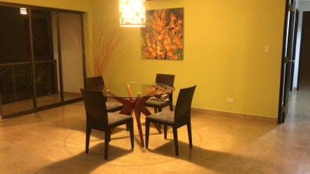 Dining with glass doors to terrace at Punta Barco Resort Panama condo
