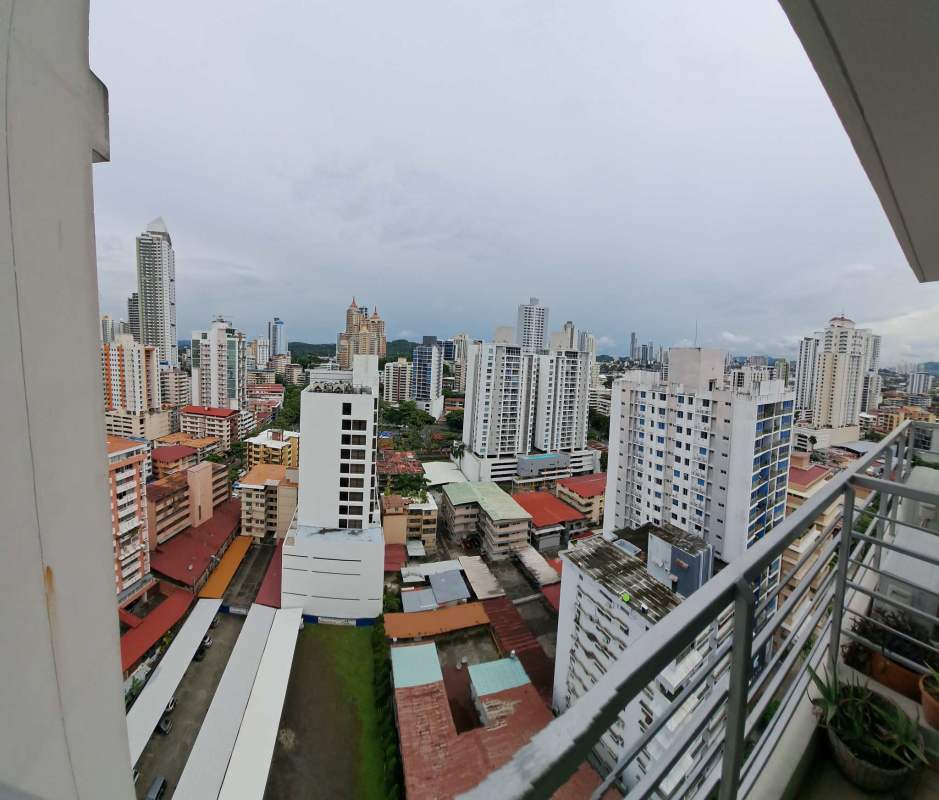 Dining area with six-seat table, mirror, modern decor in furnished apartment for rent in El Cangrejo Panama