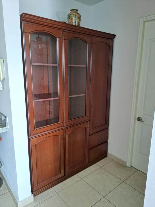 Built-in wooden cabinet with decorative vase in apartment in PH El Cangrejo Tower Panama
