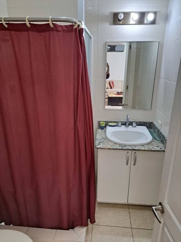 Compact bathroom with granite countertop and modern fixtures in PH El Cangrejo Tower