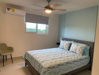 Minimalist beach condo bedroom with AC and accent wall Playa Caracol Chame Panama