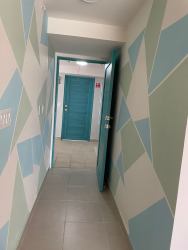 Colorful hallway with geometric design Playa Caracol beachfront apartment Panama