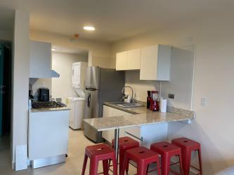 Bedroom with built-in closet ceiling fan AC coastal apartment Playa Caracol Panama