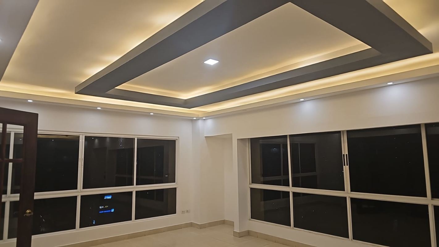 Modern open living room with natural light, tray ceiling, LED cove lights at PH Metropolitan Park in Obarrio Panama City